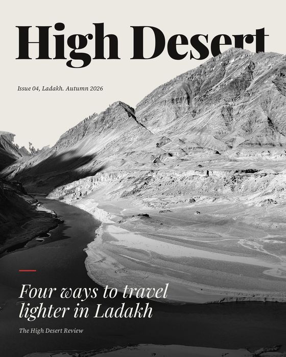 Concept poster. High Desert magazine cover, four ways to travel lighter in Ladakh, over a black and white river valley